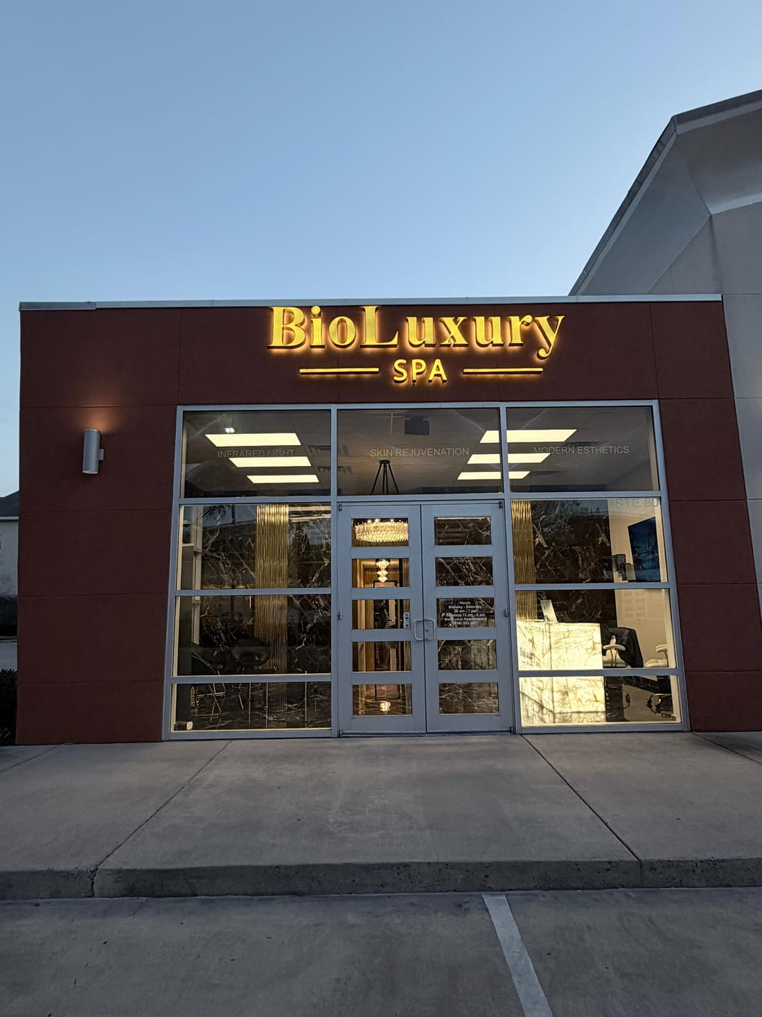 BioLuxury Spa illuminated entrance at dusk