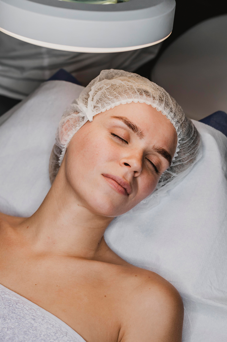 Client relaxing before facial treatment