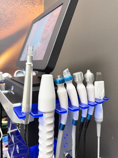 Hydrafacial machine with treatment handpieces
